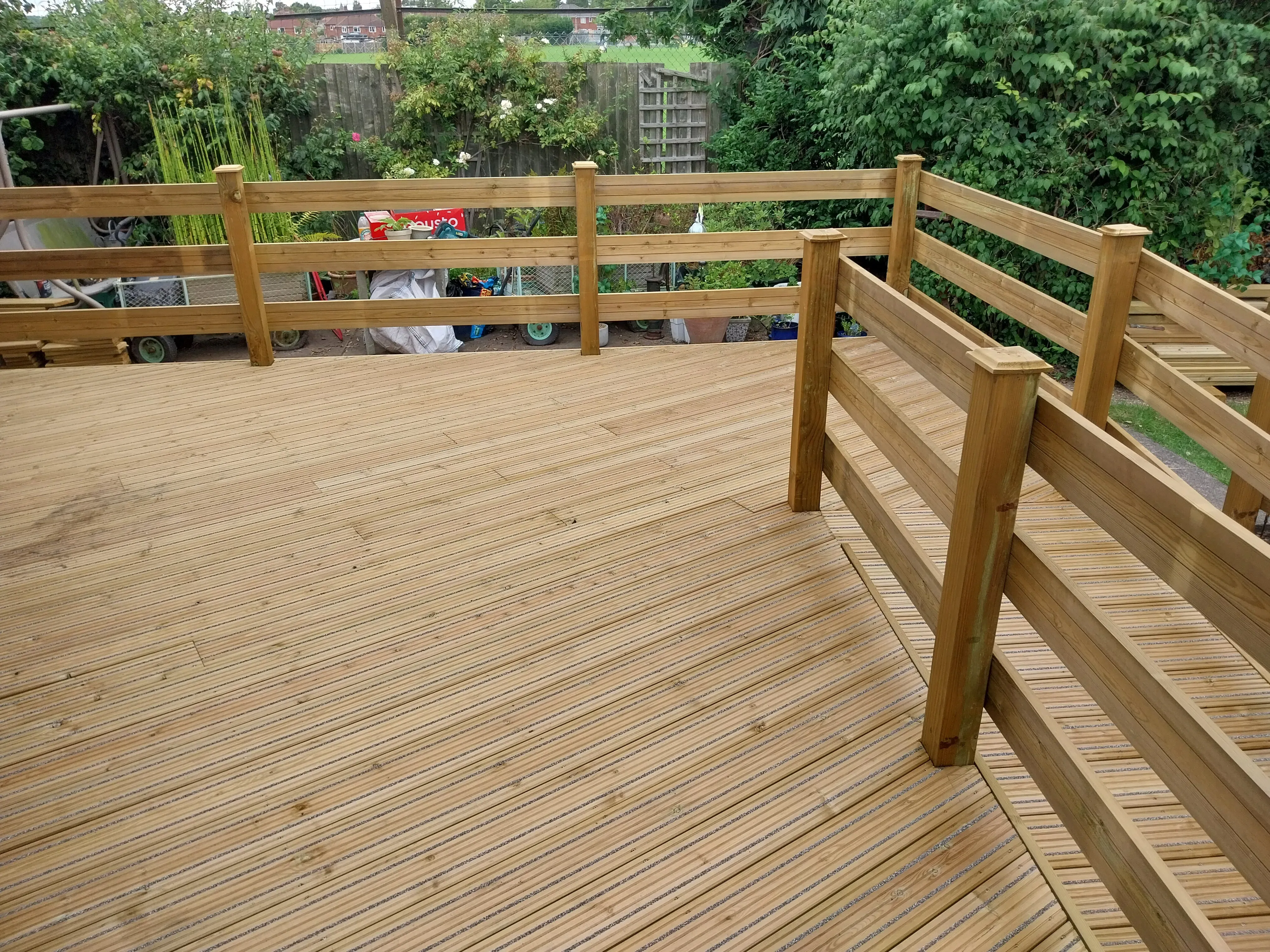 Accessible decking with ramps and slip-resistant boards